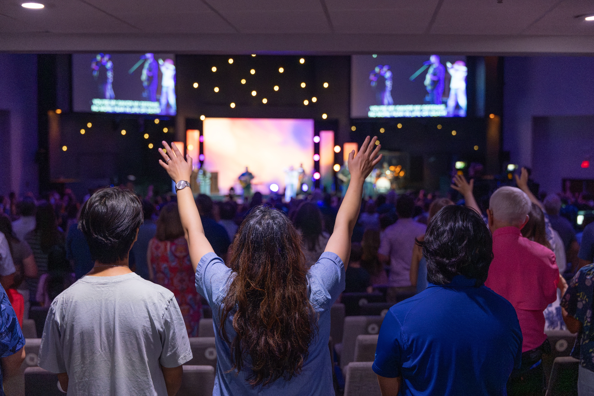 A congregation gathered together in worship during a Sunday service